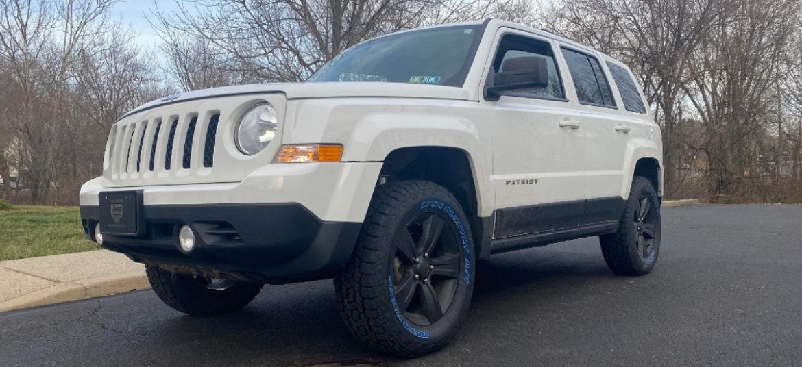Lifted Jeep Patriot with Rough Country lift kit with N3 struts