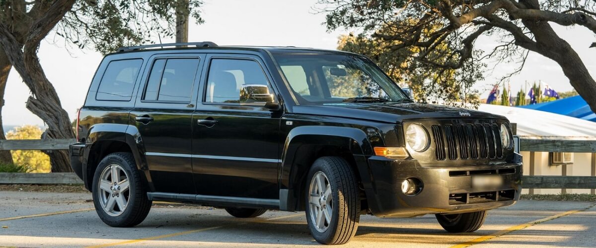 Black 2007 Jeep Patriot parked on the sideway