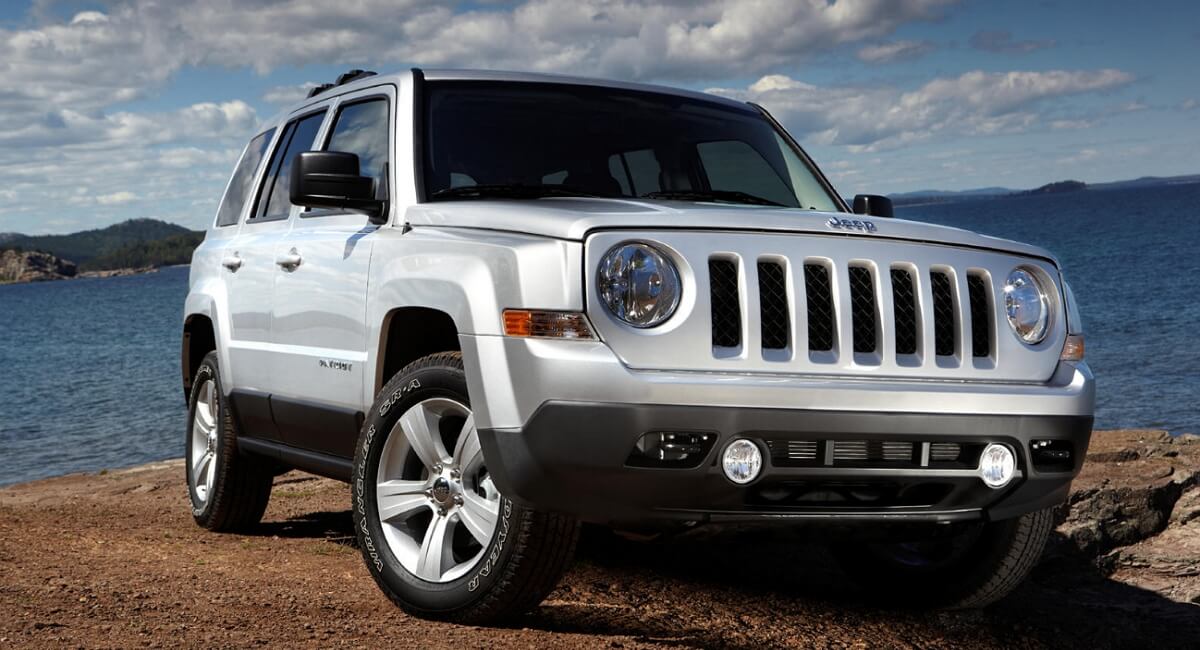 Gray 2014 Jeep Patriot wearing Goodyear tires and alloy wheels