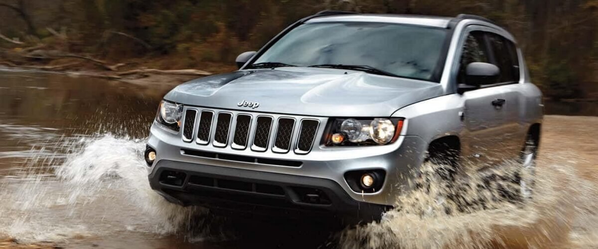 Jeep Compass driving in muddy water