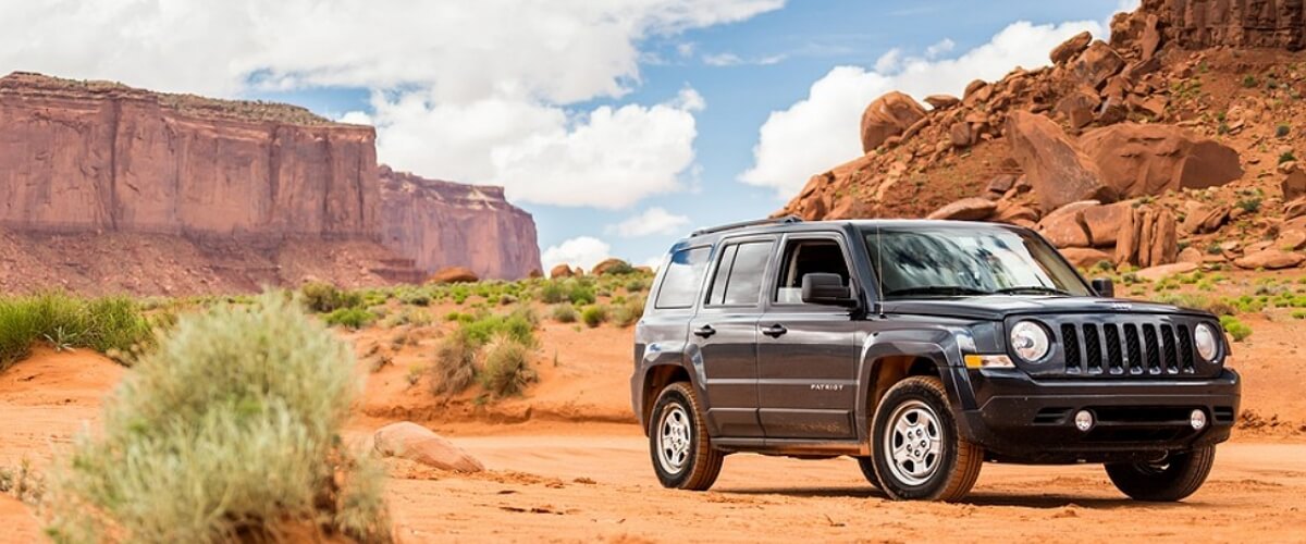 Jeep Patriot 2008 in a desert and rocks