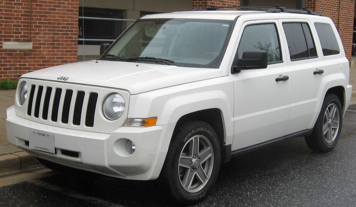 White 2012 Jeep Patriot on factory alloy wheels